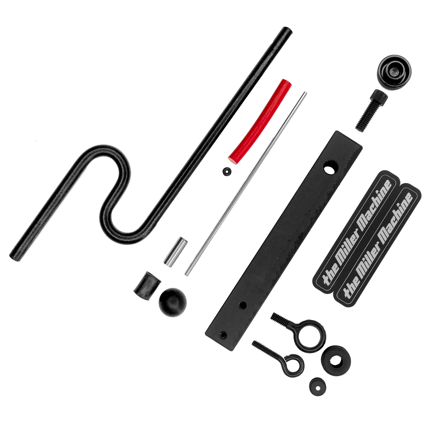 All the parts needed to make a Miller Machine, Block Machine, laid out on a flat surface.