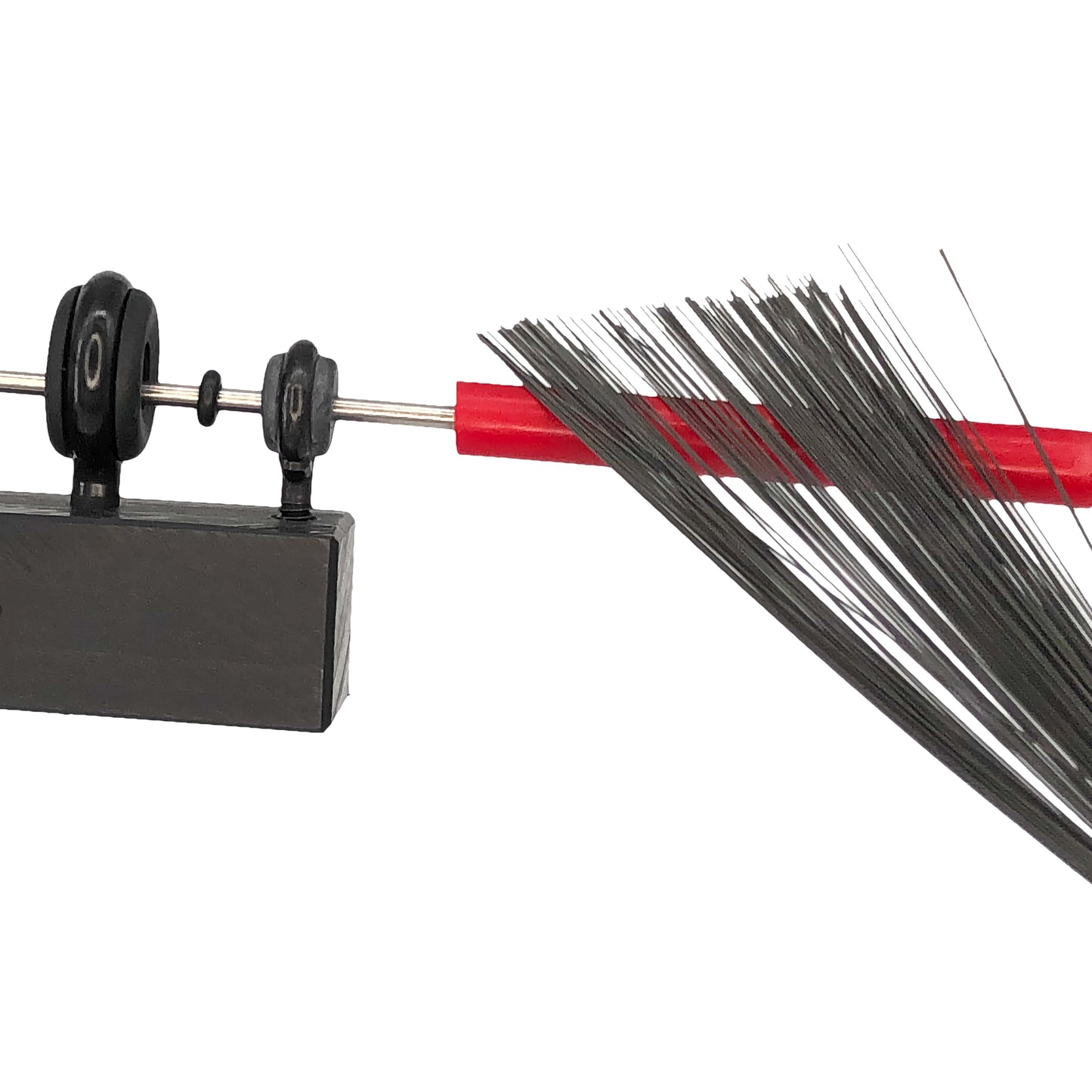 Closeup image of The Miller Machine Triangle Machine being played with a brush.