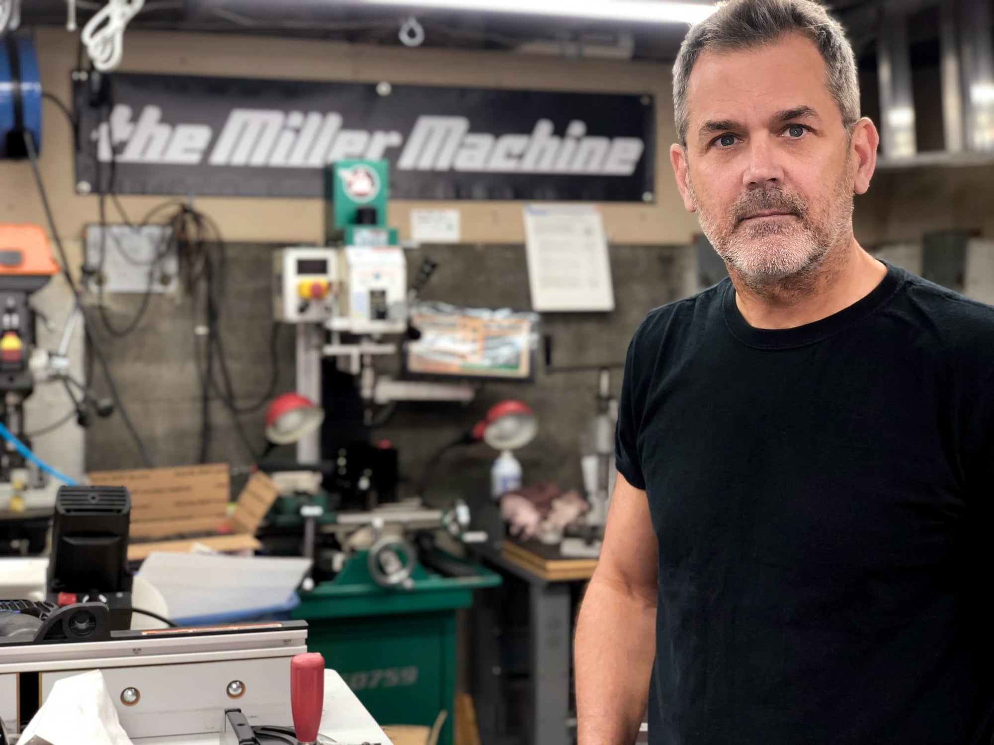 Photo of Billy Miller in his Miller Machine Workshop in Seattle, Washington.