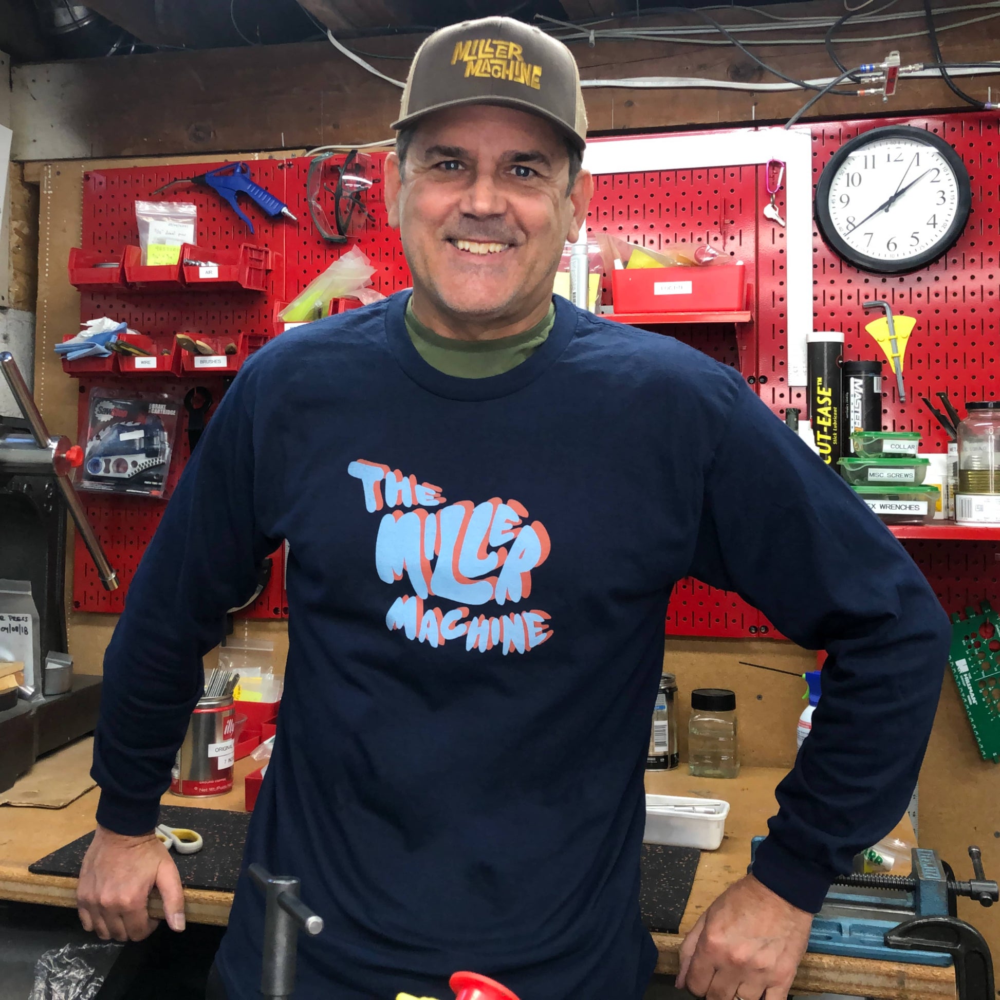 Photo of Billy Miller wearing "The Miller Machine" Faux 3D long-sleeved t-shirt in his workshop in Seattle, Washington.