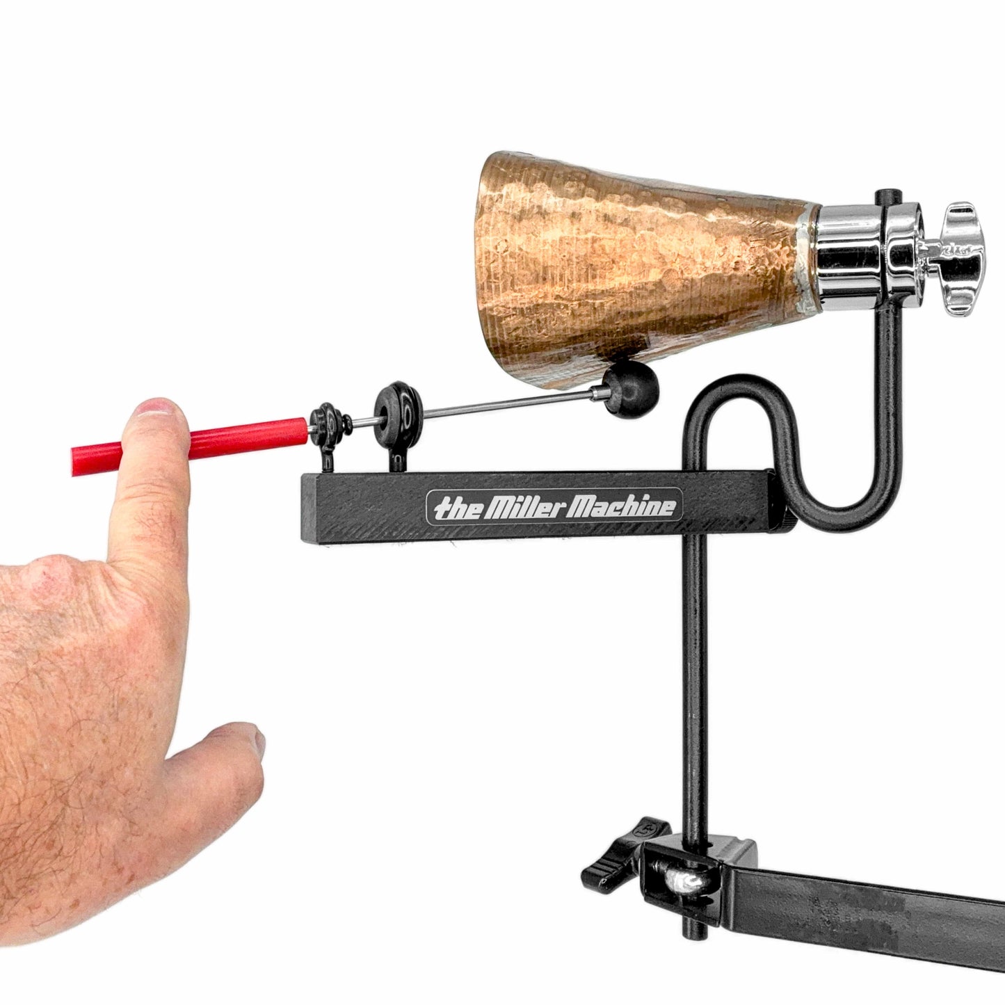 Block Machine with Black Body playing a cowbell by hitting the beater by hand.